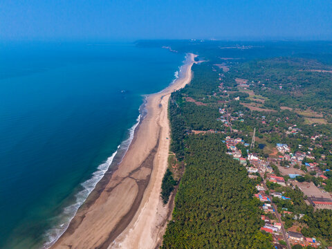 Aerial view of Guhaghar beach with sandy shore and blue sea, Ratnagiri, Maharashtra, India, Konkan.