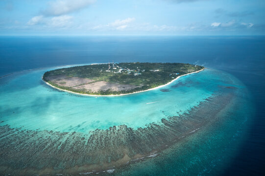 Aerial view of beautiful beach resort on Thoddoo Island, Maldives.