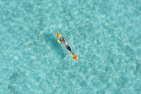 Aerial view of turquoise ocean in Thoddoo, Alif Alif Atoll, Maldives.