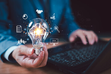 Cloud digital network, business technology solution concept. Businessman hold light bulb infographic diagram of cloud computing information technology icon. Big data connection, communication storag