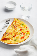 omelette with tomato, bell pepper onion and cheese. healthy breakfast