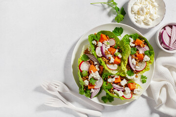healthy sweet potato lettuce boats with radish, feta cheese, lentils