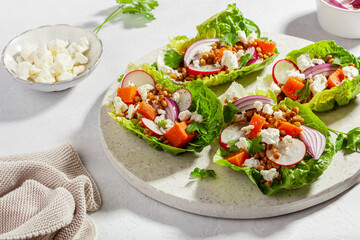 healthy sweet potato lettuce boats with radish, feta cheese, lentils
