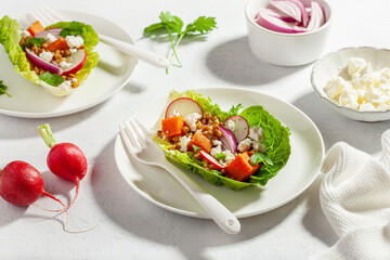 healthy sweet potato lettuce boats with radish, feta cheese, lentils
