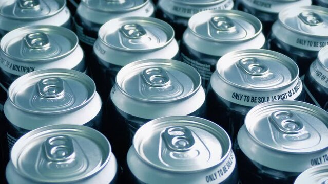 Soda Cans In Fridge At Store
