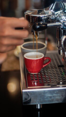 Coffee machine pouring espresso