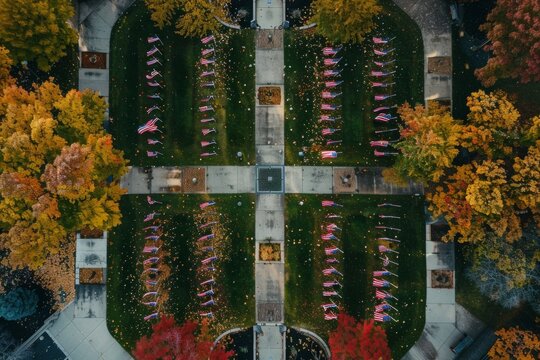 A breathtaking drone's view of a memorial park adorned with rows of American flags, creating a poignant scene that pays tribute to our veterans.