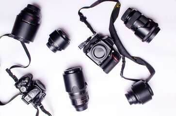 Many Lens and cameras are on isolated white background