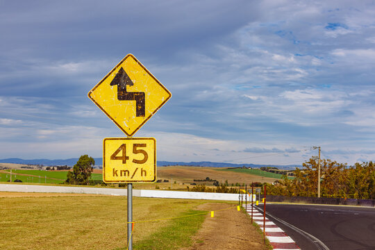 Winding road warning sign on the Mount Panorama racing circuit public road