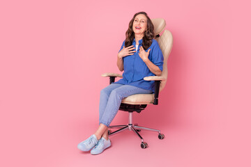 Full body photo of attractive retired woman sit armchair laugh dressed stylish blue clothes...