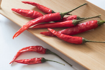 Not fresh red hot chillies on ooden tray