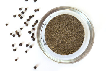 black pepper in a glass bowl closeup