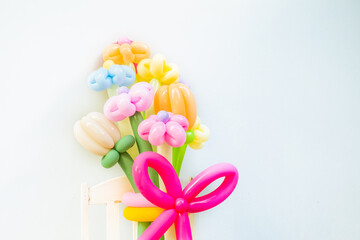 Fototapeta premium Balloons twisted into a blossoming flower bouquet on white background,Flowers Balloon to decorate the place,bouquet with colorful balloon flowers.