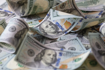 cuved U.S. 100 dollar banknotes background