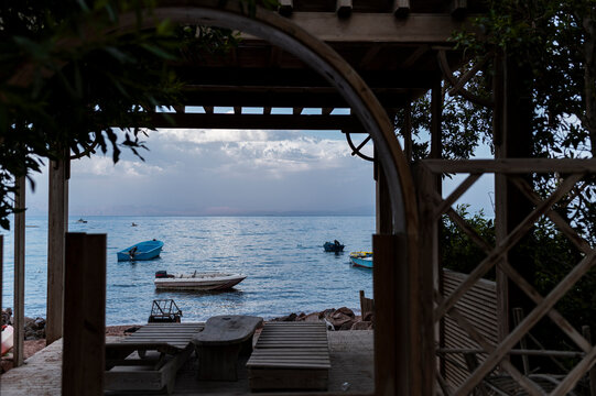Wooden Shelter Overlooking Boats on the Sea, Dahab, Red Sea, Egypt