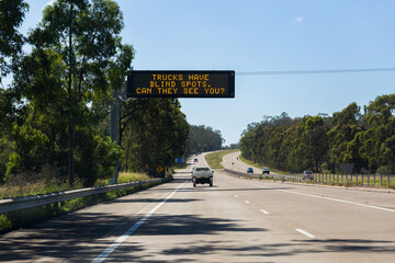 Overhead digital sign reading trucks have blind spots can they see you?