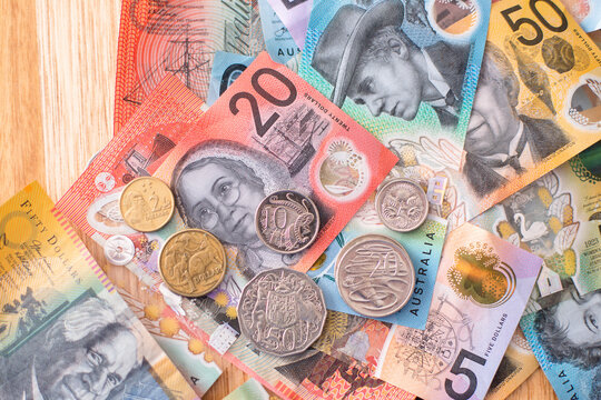 examples of all the Australian coins on an Australian note background