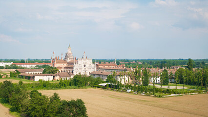 Fototapeta premium Aerial shot of Certosa di Pavia cathedral a historical monumental complex that includes a monastery and a sanctuary. Pavia ,Italy.