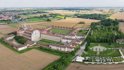 Aerial shot of Certosa di Pavia cathedral a historical monumental complex that includes a monastery...