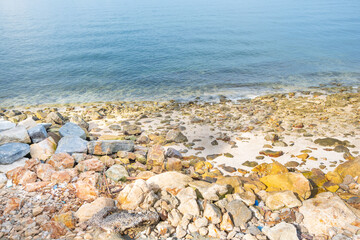 Beach sea with rocks and splashing waves,waves splashes on rock in sea shore,Summer vibe.