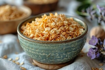 Ceramic bowl with granola on the linen tablecloth