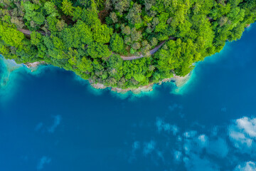 Aerial View of Lago di Ledro in Italy, Scenic Turquoise Waters and Forested Shoreline