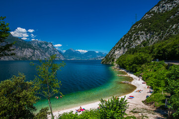 Relaxing on the Shores of Lake Garda: A Scenic View of Malcesine Beach