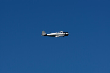 An old plane against the blue sky.