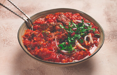 Chashushuli, a traditional Georgian dish, spicy, stewed meat with tomatoes and spices, homemade, no people,