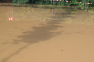 muddy flood, calm while lowering already