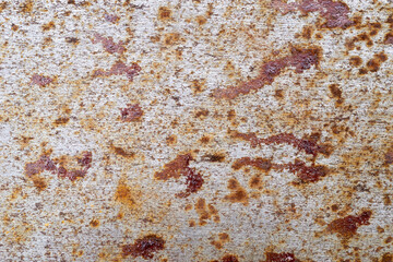 an intricate abstract pattern formed by rust and oxidation. The warm tones of orange and brown create a captivating visual, reminiscent of weathered metal surfaces