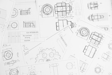 paper engineering drawings of industrial parts and mechanisms	
