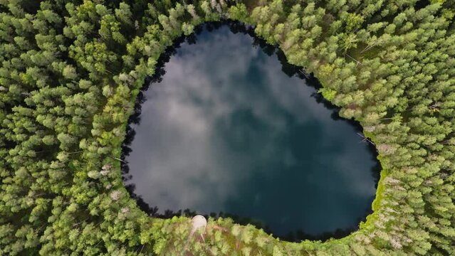 Aerial View of Latvian Lake Surrounded by Forest. Velnezers, Certoka ezers Aglona.