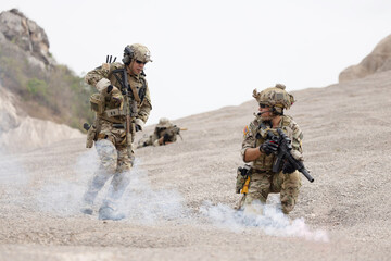 Soldier in camouflage military uniforms ready for battle in afghanistan