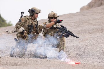 Soldier in camouflage military uniforms ready for battle in afghanistan