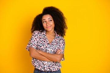 Photo portrait of pretty young girl crossed hands look empty space wear trendy leopard print outfit...