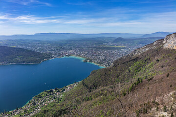 Obraz premium Wonderful views on a walk above the picturesque Lake Annecy. Route along the ridge from Mont Veyrier to Mont Baron from Annecy. Annecy, Haute-Savoie, France.