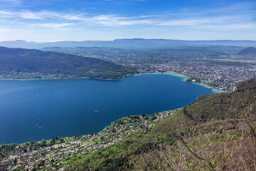 Naklejka premium Wonderful views on a walk above the picturesque Lake Annecy. Route along the ridge from Mont Veyrier to Mont Baron from Annecy. Annecy, Haute-Savoie, France.