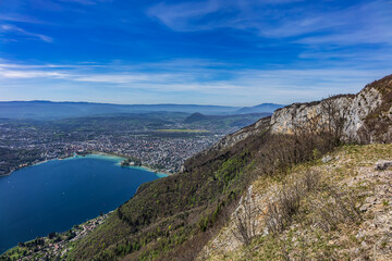 Wonderful views on a walk above the picturesque Lake Annecy. Route along the ridge from Mont Veyrier to Mont Baron from Annecy. Annecy, Haute-Savoie, France.