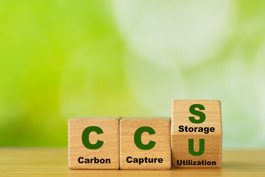 Wooden cubes form the symbol CCU (carbon capture utilization) and CCS (carbon capture storage). Environmental Business concept,  Net zero action, Save energy, green energy, reduce carbon footprint