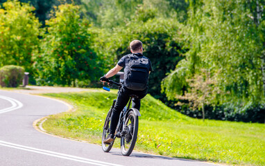 Cyclist ride on the bike path in the city Park
