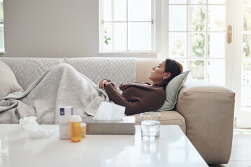 Woman, couch and sad or sick in home, cold and medicine for illness and treatment for health....