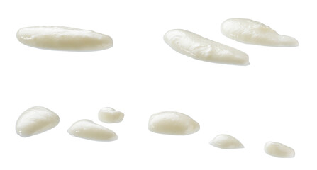 Spilled yogurt puddle isolated, drops of yogurt isolated on white background.