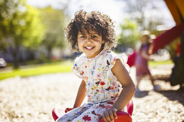 Happy kid on playground on summer season