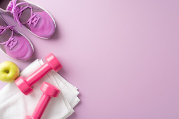 Flat lay of fitness equipment including pink sneakers, dumbbells, towel, and apple on a pastel...