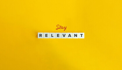 Stay Relevant Phrase and Banner. Concept of continuously adapt, update, and evolve in order to maintain significance, importance, or usefulness. Text on Block Letter Tiles on Flat Background.