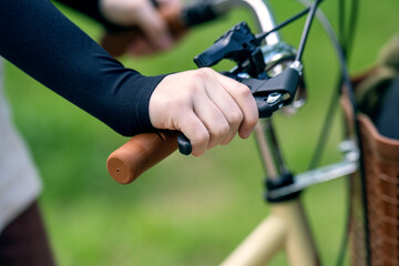 Child hand mistakenly pressing on a bicycle handbrake lever
