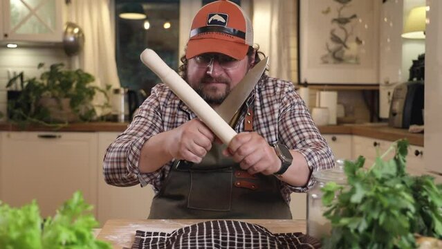 a male chef makes kutab dough in a home kitchen