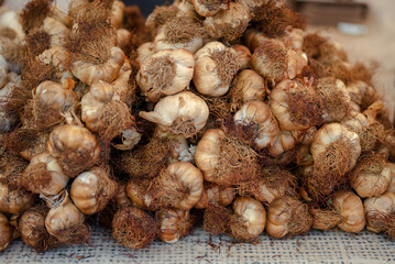 Close-up of smoked garlic at the market. 