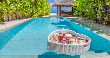 Fresh breakfast swimming pool, floating breakfast luxurious tropical resort. Heart shape tray...